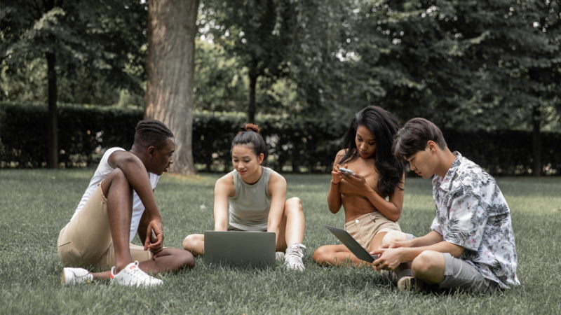 Group using devices in the park